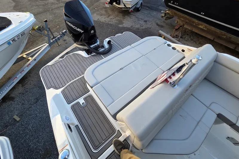 Slide: The Image of 2024 Sea Ray 270 Sundeck boat with Mercury outboard engine and spacious deck. - 6