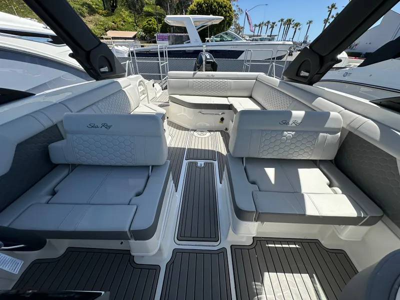 Slide: The Image of 2024 Sea Ray SDX 270 Outboard interior with luxurious seating and modern design. - 12