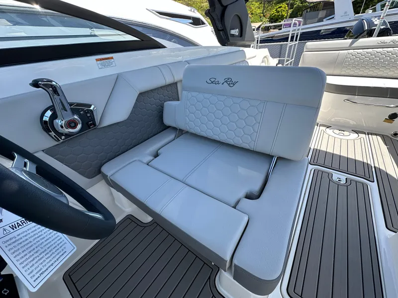 Slide: The Image of 2024 Sea Ray SDX 270 Outboard interior with luxurious seating and modern design. - 13