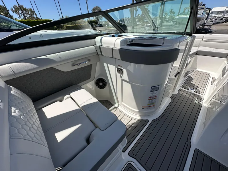 Slide: The Image of 2024 Sea Ray SDX 270 Outboard interior with sleek seating and modern design. - 16