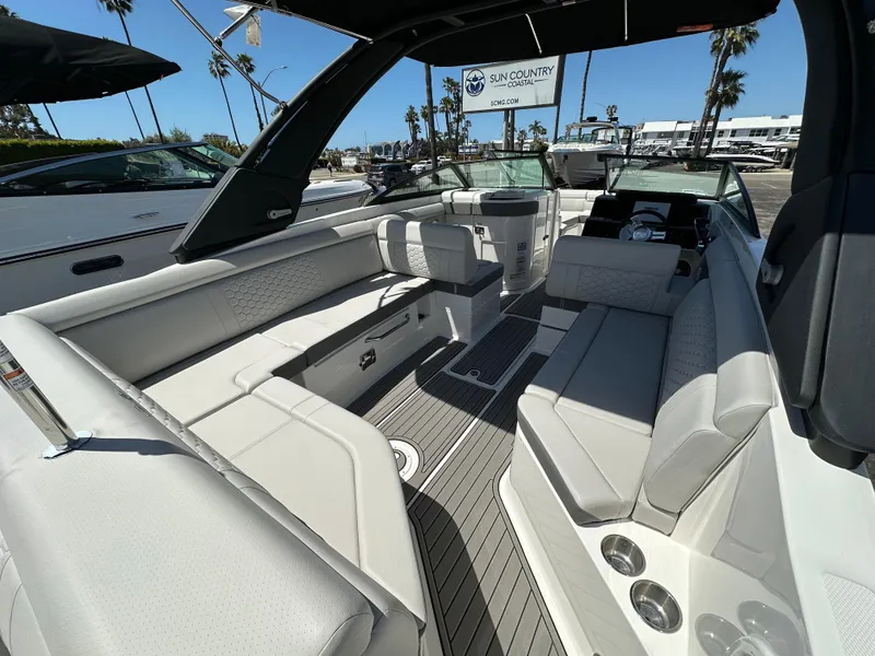 Slide: The Image of 2024 Sea Ray SDX 270 Outboard boat interior with spacious seating and modern design. - 7