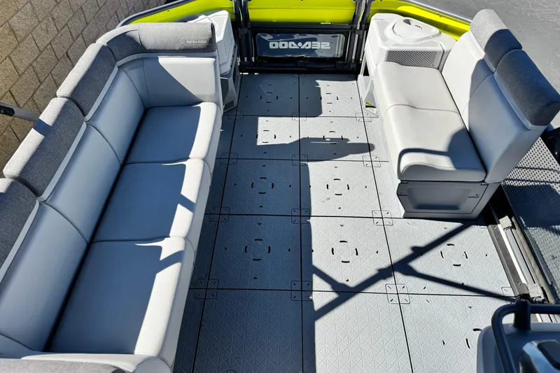 Slide: The Image of 2023 Sea-Doo Switch Cruise 21 interior with spacious seating and modular deck design. - 11