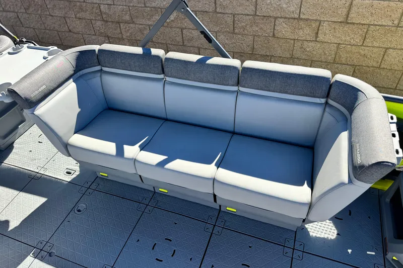 Slide: The Image of 2023 Sea-Doo Switch Cruise 21 seating, featuring gray cushioned bench on deck. - 14