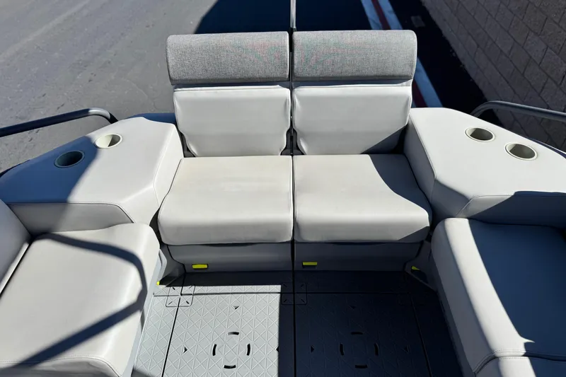 Slide: The Image of 2023 Sea-Doo Switch Cruise 21 interior seating with cup holders, showcasing comfort and design. - 19