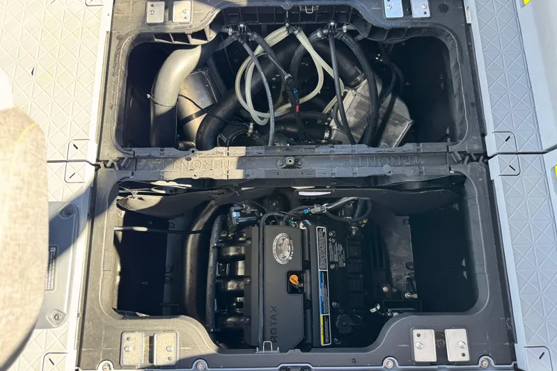 Slide: The Image of Engine compartment of 2023 Sea-Doo Switch Cruise 21, showcasing internal components and layout. - 21