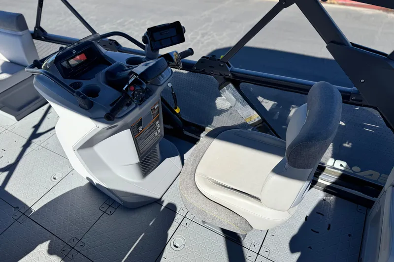 Slide: The Image of 2023 Sea-Doo Switch Cruise 21 cockpit with steering console and comfortable seating. - 22