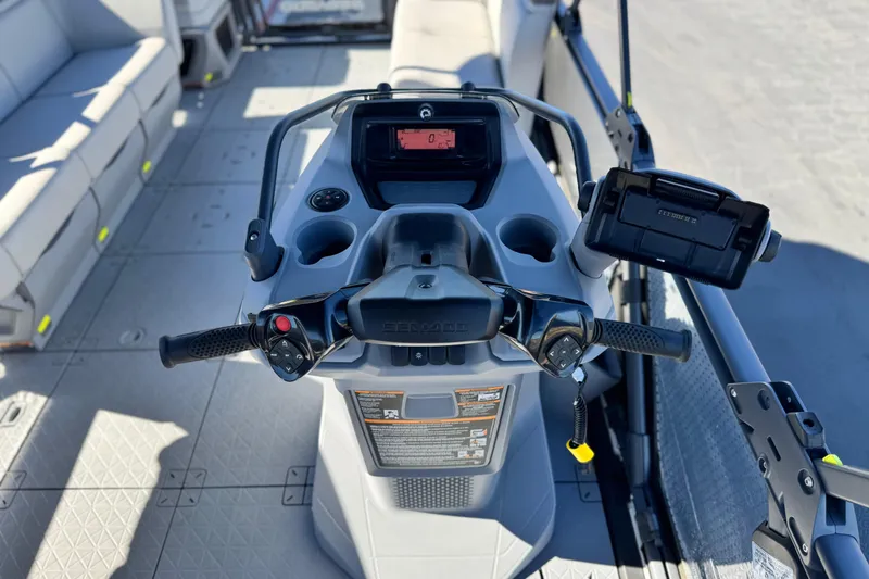 Slide: The Image of 2023 Sea-Doo Switch Cruise 21 dashboard with steering controls and seating area. - 23
