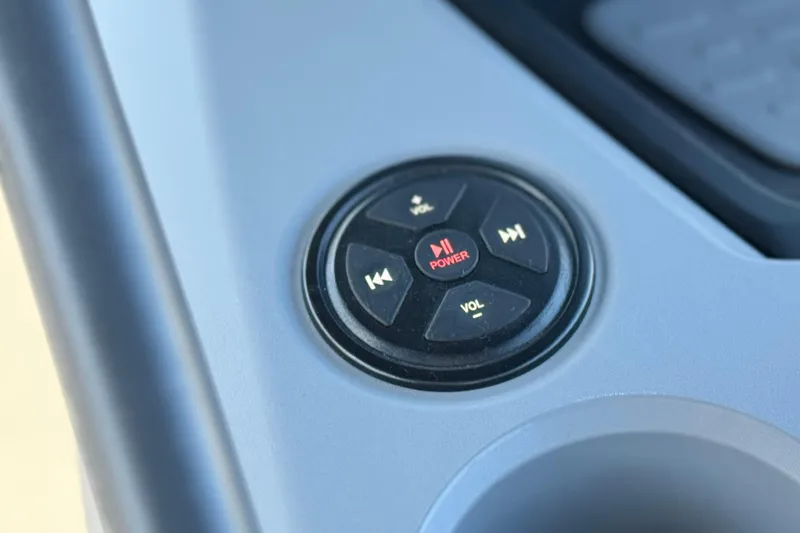 Slide: The Image of Control panel of 2023 Sea-Doo Switch Cruise 21 with power and volume buttons. - 25