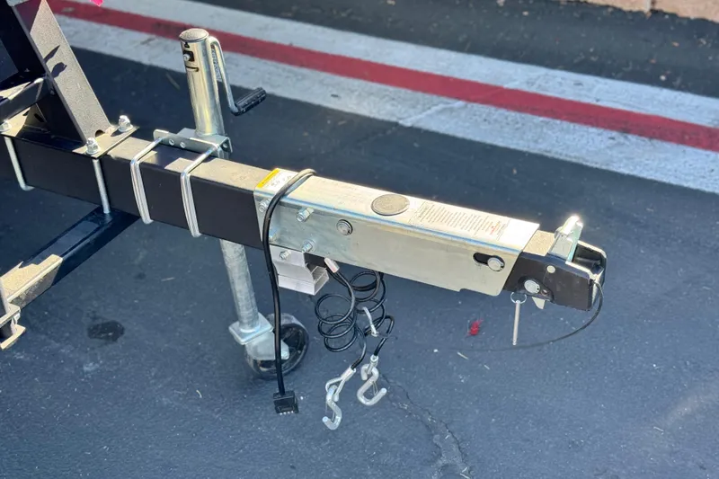 Slide: The Image of Trailer hitch of 2023 Sea-Doo Switch Cruise 21 on asphalt surface. - 28