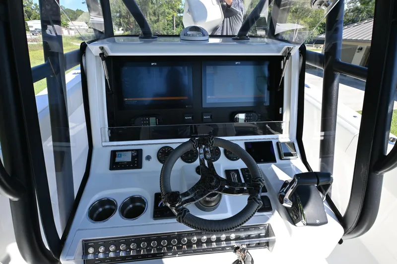 Slide: The Image of 2024 SeaVee 340Z boat dashboard with advanced navigation and control systems. - 13