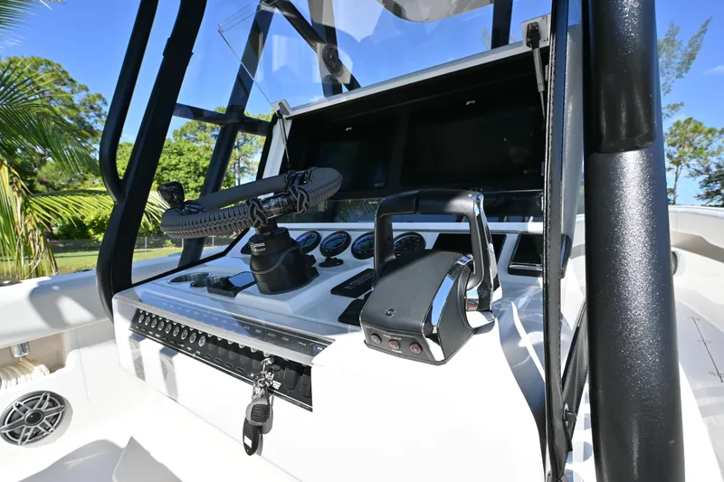 Slide: The Image of 2024 SeaVee 340Z boat console with steering wheel and controls, featuring modern design. - 14