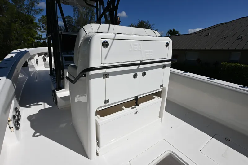Slide: The Image of 2024 SeaVee 340Z boat interior with storage compartments and seating. - 15