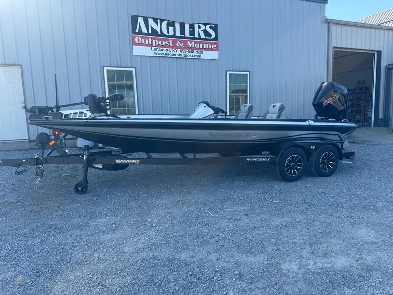 Slide: The Image of 2026 Phoenix 721 ZXL boat on trailer outside Anglers Outpost & Marine. - 11