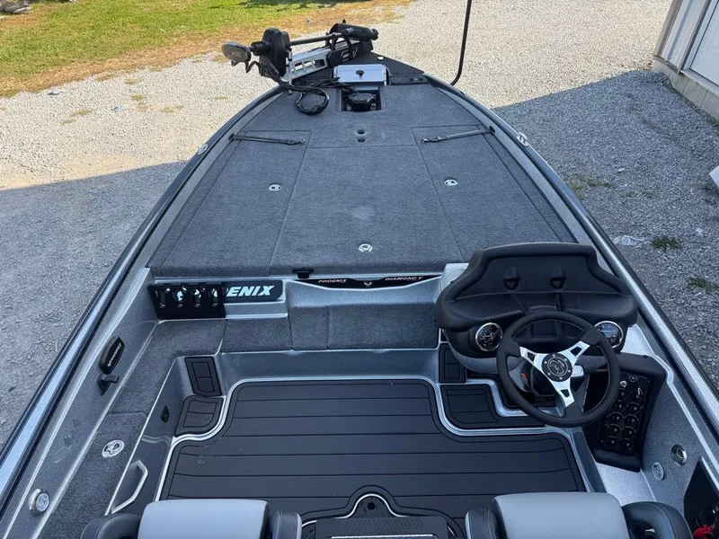 Slide: The Image of 2026 Phoenix 721 ZXL boat interior with steering wheel and spacious deck. - 8