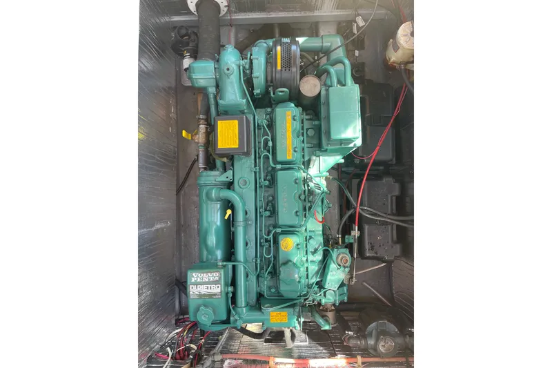 Slide: The Image of Engine of 1988 Cape Dory Hardtop boat, featuring a Volvo Penta diesel engine. - 12