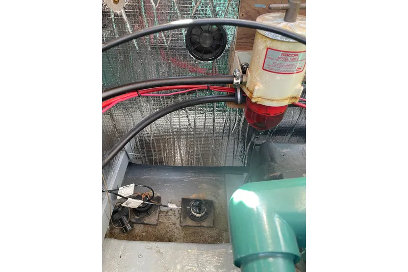 Slide: The Image of 1988 Cape Dory Hardtop engine compartment with fuel filter and wiring. - 13