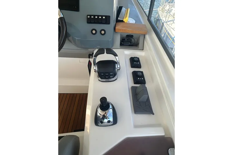 Slide: The Image of Control panel of a 2012 Beneteau Gran Turismo 44 yacht, featuring modern navigation equipment. - 10