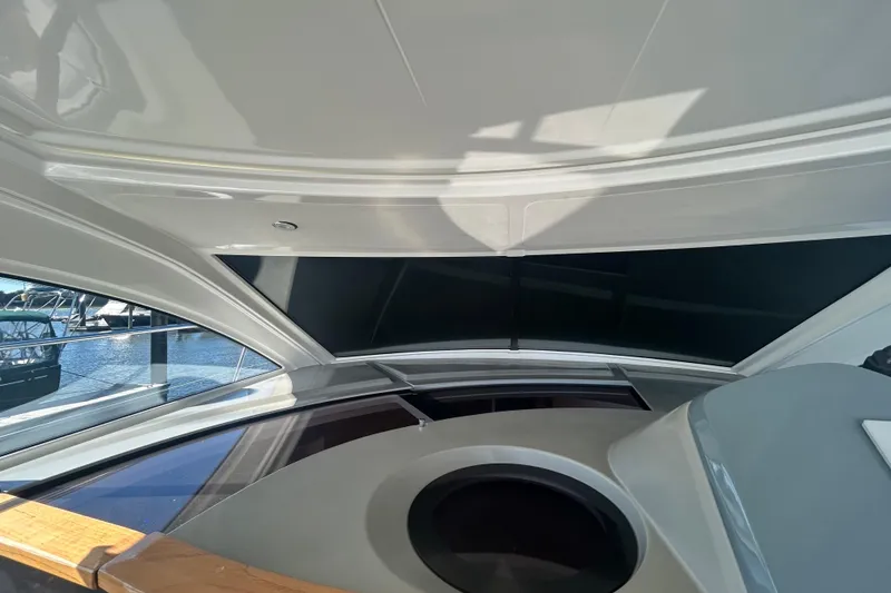 Slide: The Image of Interior view of 2012 Beneteau Gran Turismo 44 yacht, showcasing sleek design and windows. - 11