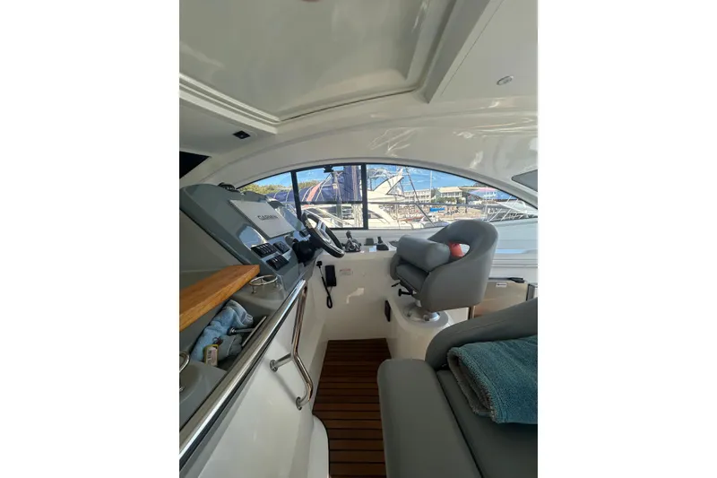 Slide: The Image of Interior of 2012 Beneteau Gran Turismo 44 yacht cockpit with steering wheel and seating. - 14