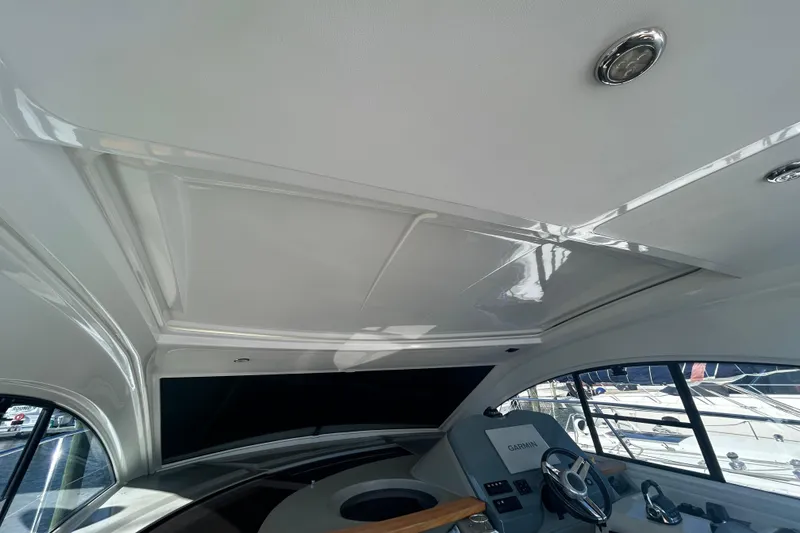 Slide: The Image of Interior view of 2012 Beneteau Gran Turismo 44 yacht helm with Garmin navigation system. - 16