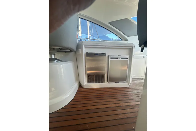 Slide: The Image of Interior of 2012 Beneteau Gran Turismo 44 yacht with wooden flooring and built-in appliances. - 17