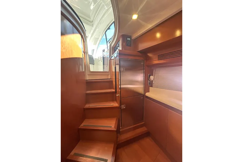 Slide: The Image of Interior view of 2012 Beneteau Gran Turismo 44 yacht with wooden stairs and modern cabinetry. - 19