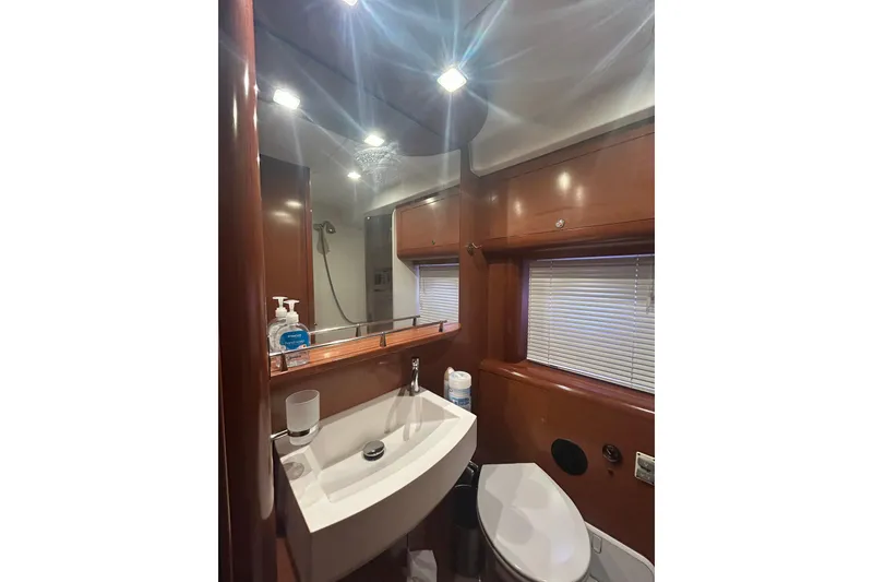 Slide: The Image of Luxurious bathroom in 2012 Beneteau Gran Turismo 44 yacht with modern fixtures and wood accents. - 30