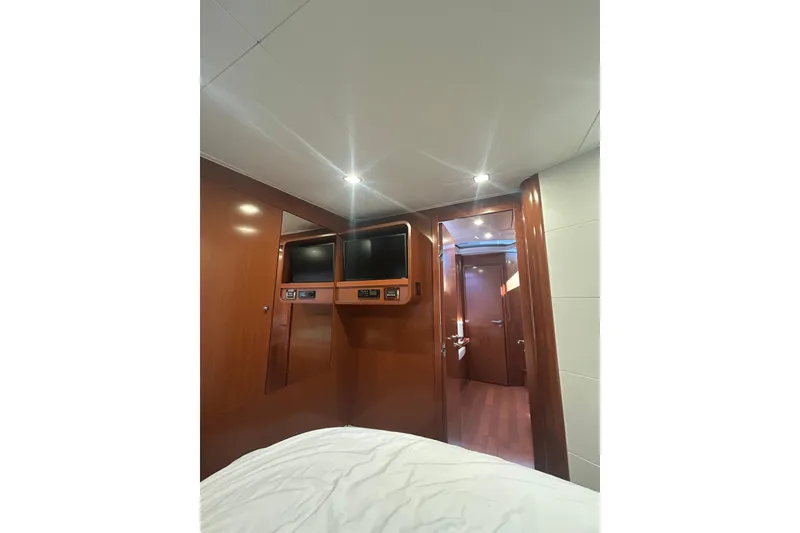 Slide: The Image of Interior cabin of 2012 Beneteau Gran Turismo 44 yacht with wood paneling and modern amenities. - 36