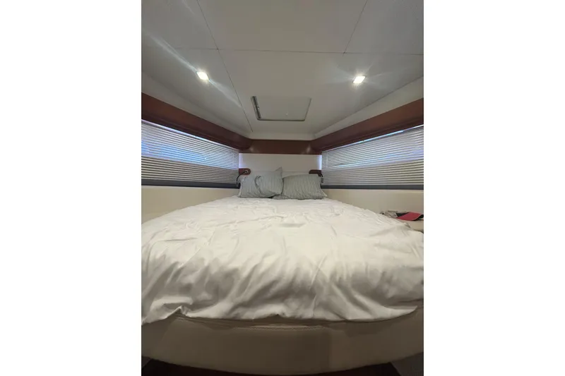 Slide: The Image of Interior cabin of 2012 Beneteau Gran Turismo 44 yacht with cozy bed and modern lighting. - 37