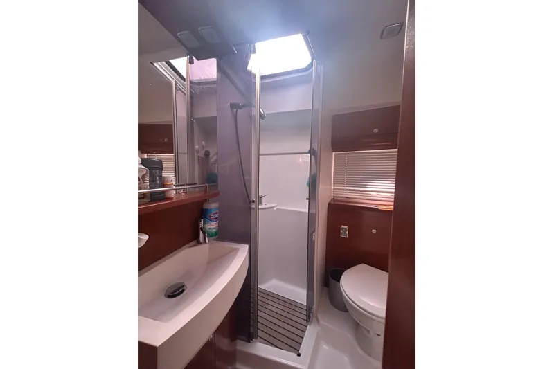 Slide: The Image of Bathroom interior of 2012 Beneteau Gran Turismo 44 yacht, featuring sink, shower, and toilet. - 39