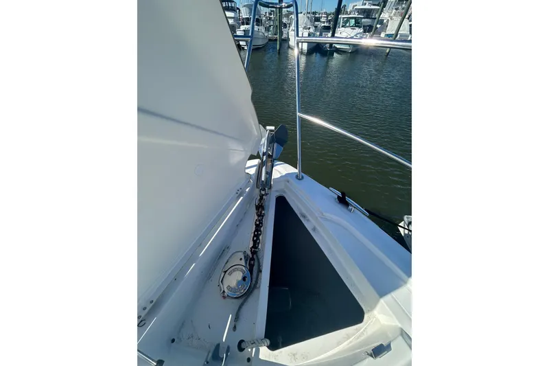 Slide: The Image of Anchor chain compartment on 2012 Beneteau Gran Turismo 44 yacht, docked in marina. - 44