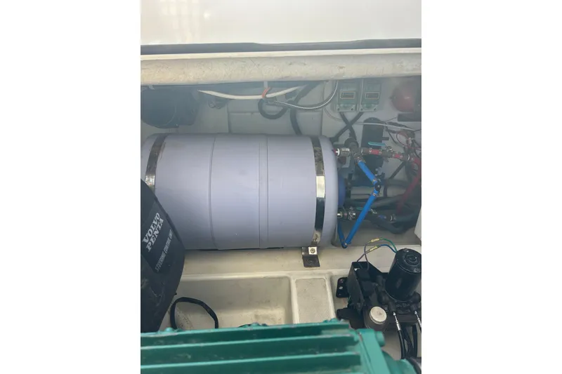 Slide: The Image of Engine compartment of a 2012 Beneteau Gran Turismo 44 with visible components and wiring. - 55