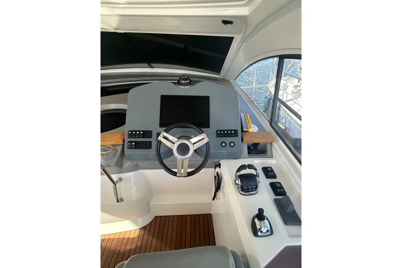 Slide: The Image of Cockpit of 2012 Beneteau Gran Turismo 44 yacht with modern steering and controls. - 7