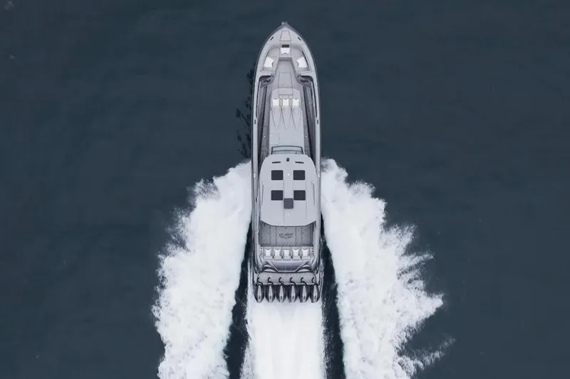 Slide: The Image of Aerial view of 2026 Deep Impact 499 Sport boat speeding on water. - 12