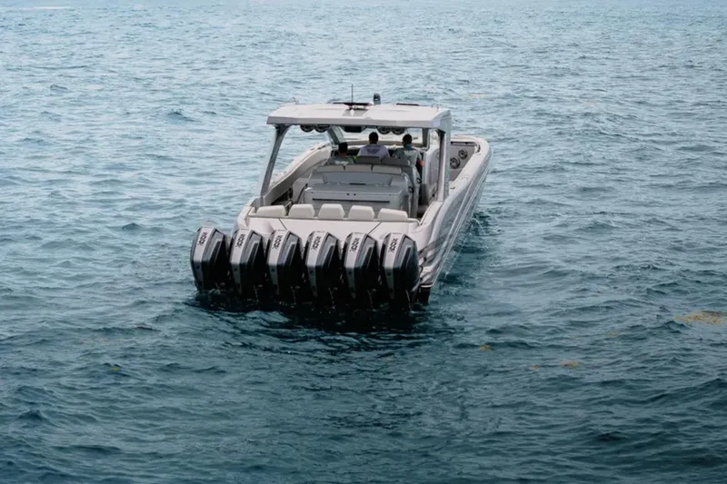 Slide: The Image of 2026 Deep Impact 499 Sport boat with multiple engines on open water. - 16