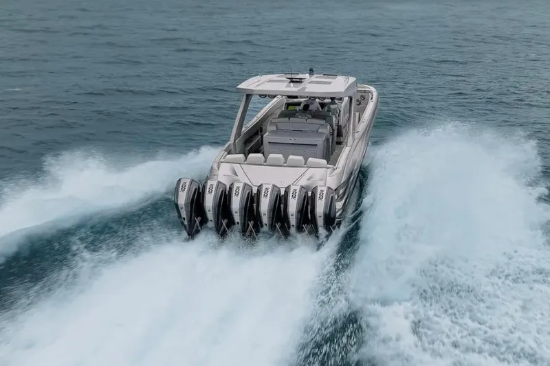 Slide: The Image of 2026 Deep Impact 499 Sport boat speeding on open water, showcasing powerful engines. - 17