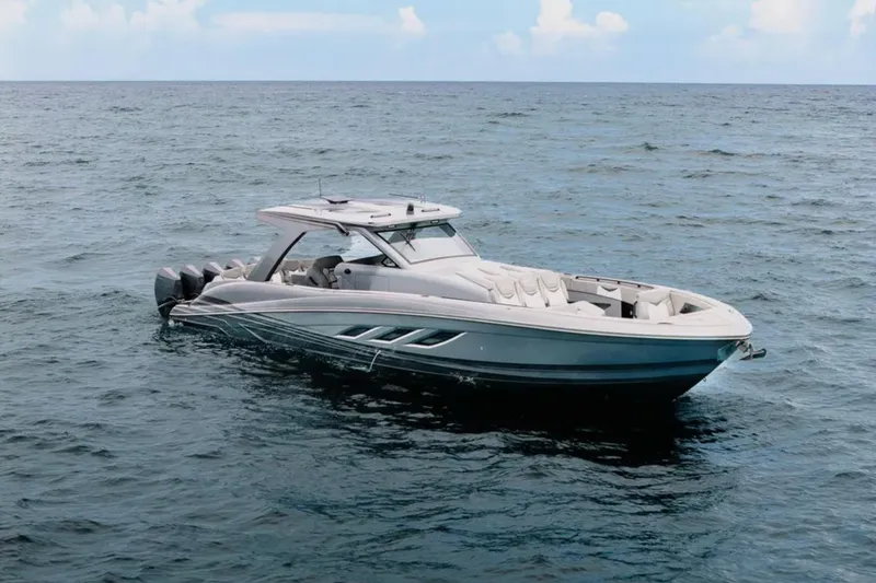 Slide: The Image of 2026 Deep Impact 499 Sport boat on open sea, sleek design, calm waters. - 19