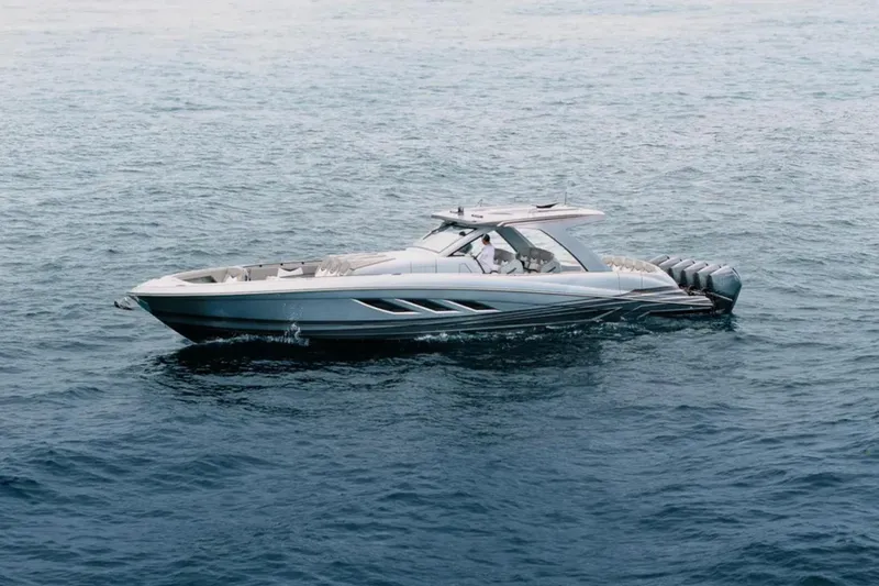Slide: The Image of Luxury 2026 Deep Impact 499 Sport boat cruising on open water. - 20