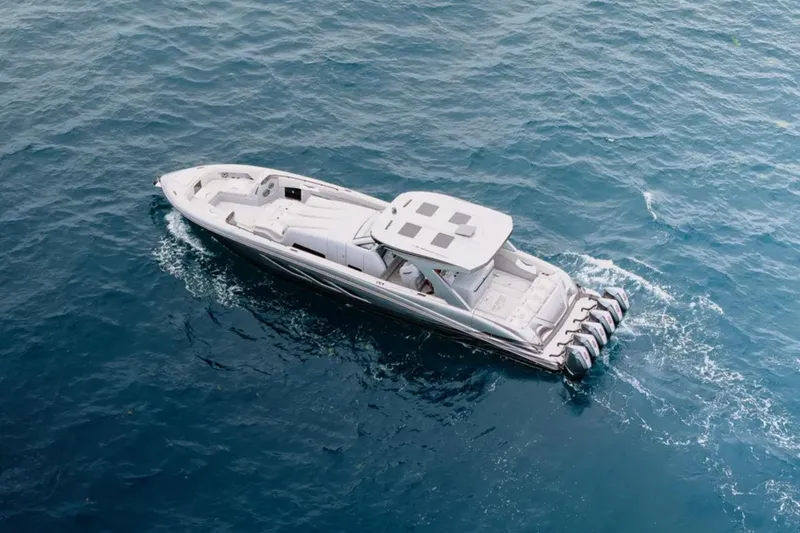 Slide: The Image of Aerial view of 2026 Deep Impact 499 Sport boat cruising on blue ocean waters. - 21