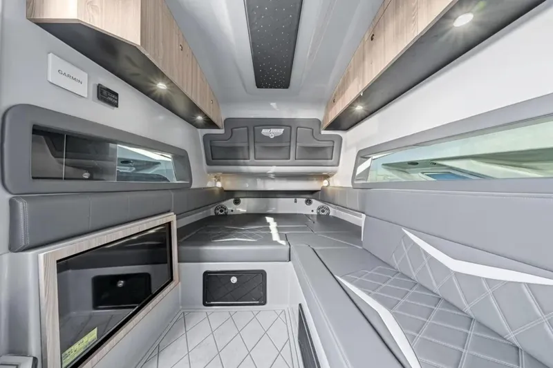 Slide: The Image of Luxurious interior of 2026 Deep Impact 499 Sport boat with modern seating and storage. - 25