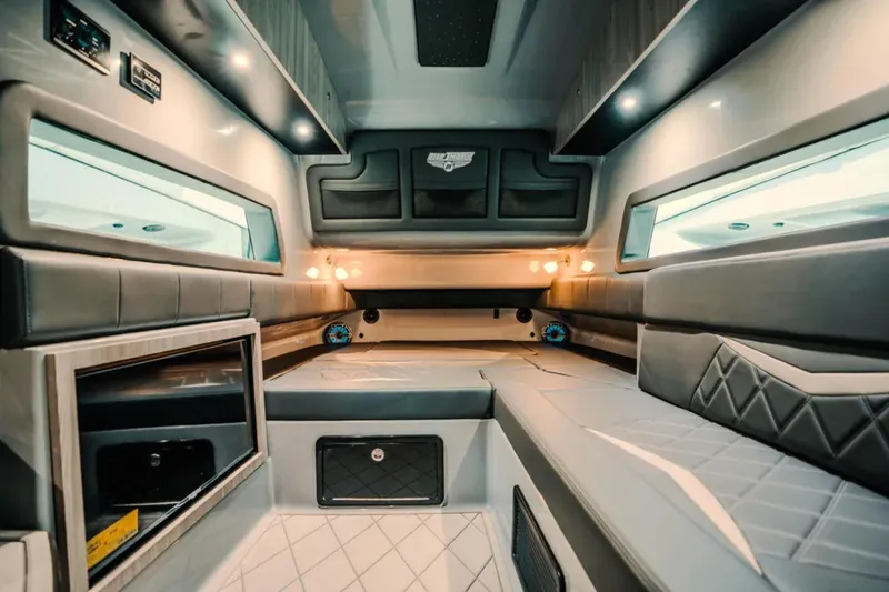 Slide: The Image of Luxurious interior of 2026 Deep Impact 499 Sport boat with modern seating and lighting. - 26