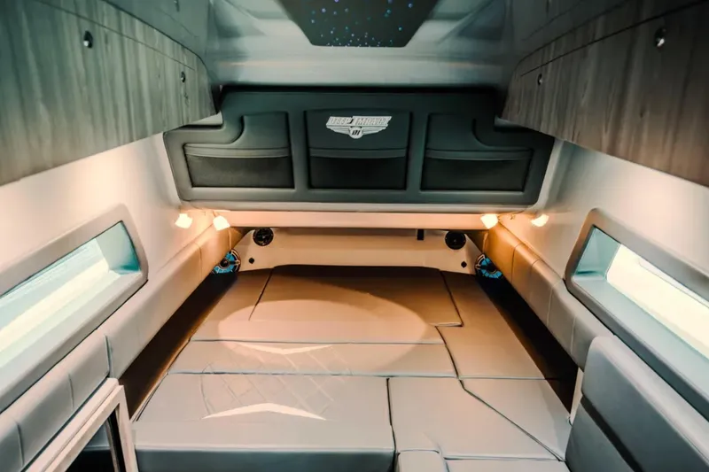 Slide: The Image of Interior cabin of 2026 Deep Impact 499 Sport boat, featuring modern design and ambient lighting. - 27
