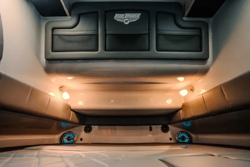 Slide: The Image of Interior of 2026 Deep Impact 499 Sport boat with ambient lighting and sleek design. - 28