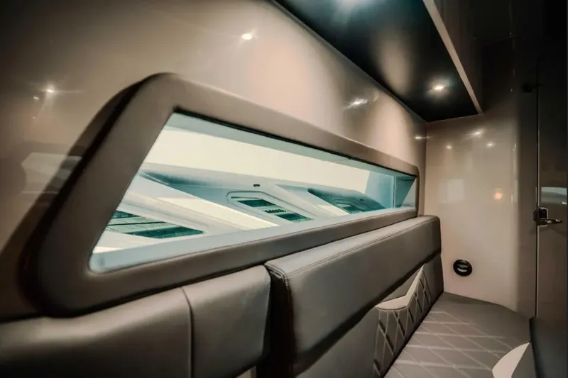 Slide: The Image of Interior of 2026 Deep Impact 499 Sport boat, featuring sleek seating and modern design. - 29