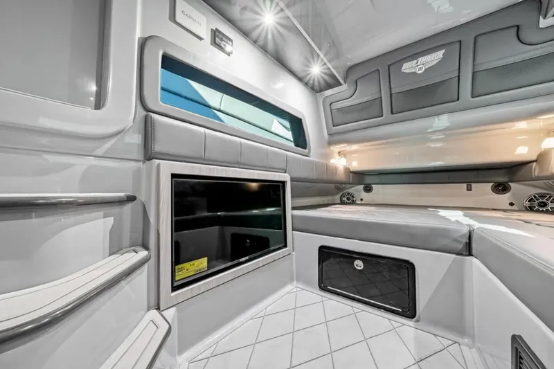 Slide: The Image of Luxurious interior of 2026 Deep Impact 499 Sport boat with modern amenities and sleek design. - 30