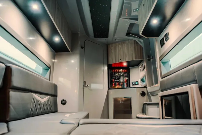 Slide: The Image of Luxurious interior of 2026 Deep Impact 499 Sport boat with modern amenities and lighting. - 32