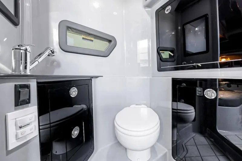 Slide: The Image of Modern bathroom interior in 2026 Deep Impact 499 Sport boat, featuring sleek design and fixtures. - 34