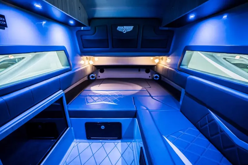 Slide: The Image of Luxurious interior of 2026 Deep Impact 499 Sport boat with blue ambient lighting. - 35