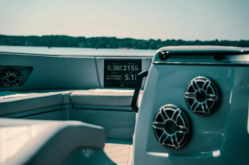 Slide: The Image of Interior of 2026 Deep Impact 499 Sport boat with speakers and navigation display. - 40