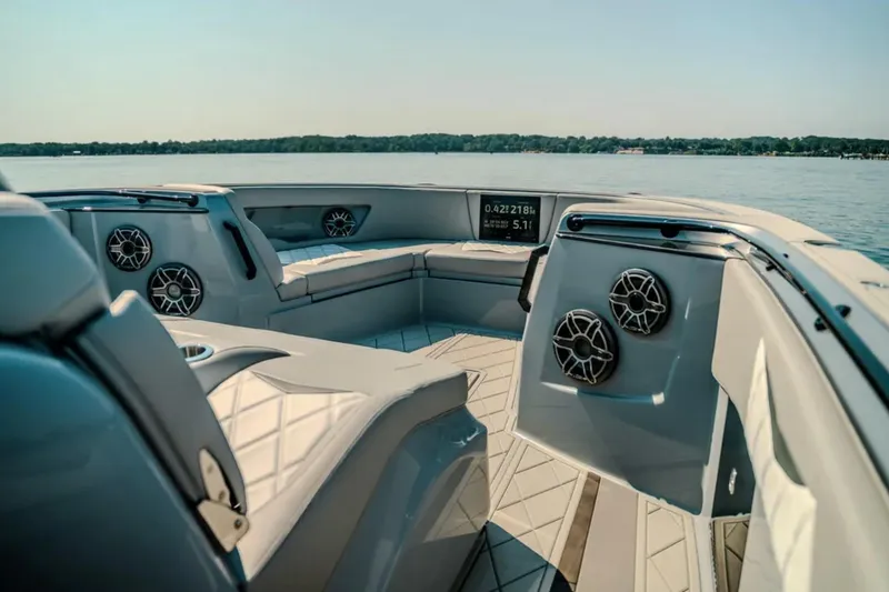 Slide: The Image of Luxurious interior of 2026 Deep Impact 499 Sport boat with premium seating and speakers. - 48
